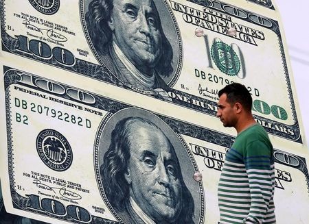 Dollar stabilizes near recent highs; sterling gains on strong PMI data