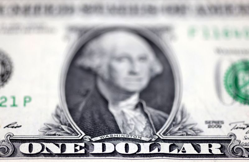 Dollar hovers near one-week high on hawkish Fed minutes; kiwi firm