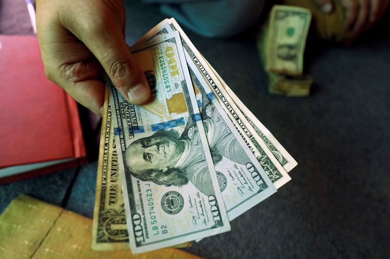 Dollar loses some ground ahead of key global inflation readings